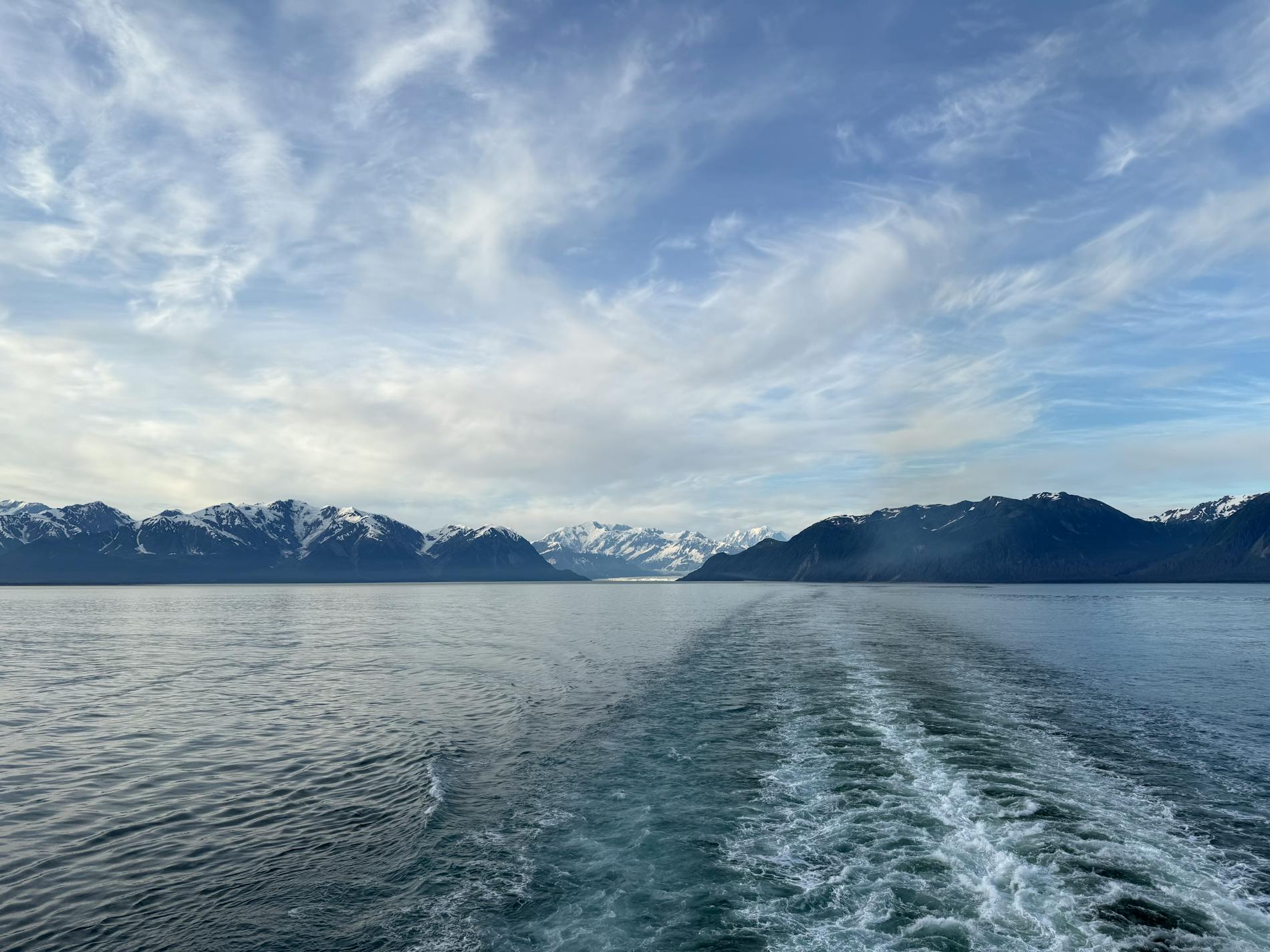 Snow-capped mountains seen from the ocean
